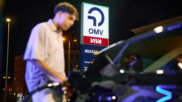 Man at OMV filling station at night