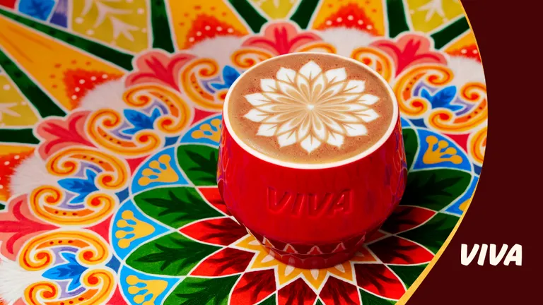 Red cup of coffee on a colorful background