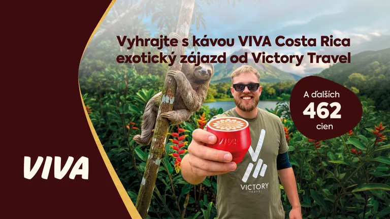 A man holding a red coffee cup with mountains and a sloth in the background